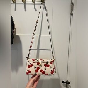 Coach Noa mini messenger crossbody cherry print bag. Like new condition.